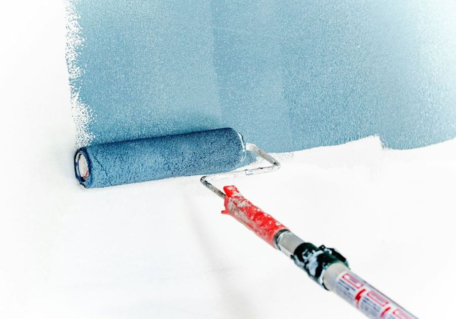 Painting a wall with a roller